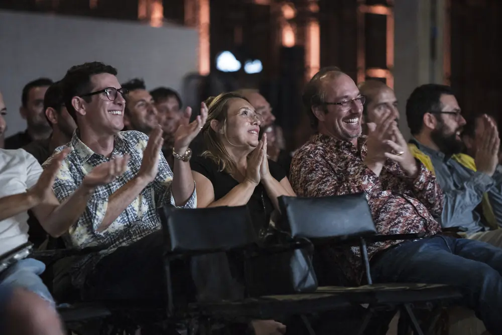 Audience applauding and smiling